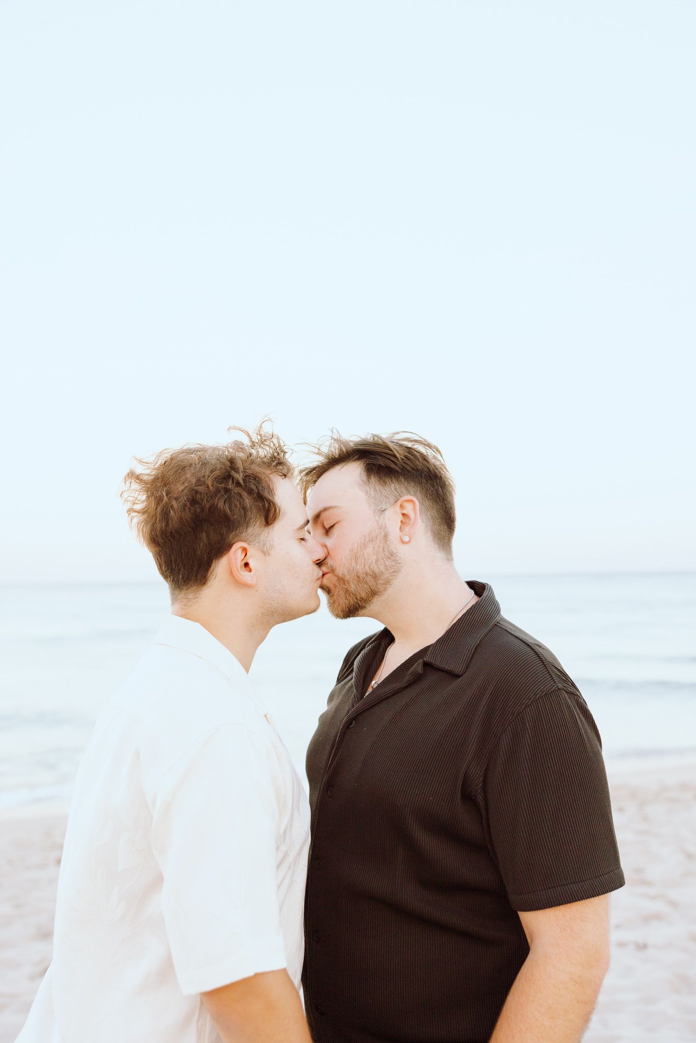 LGBTQ+ couple kissing on North Miami Beach in Florida