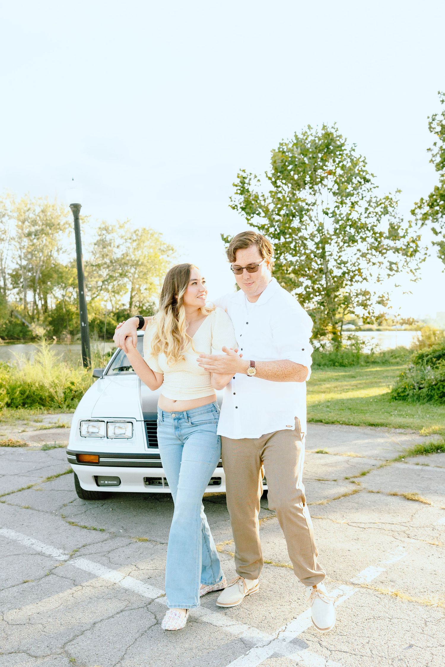 Engaged couple swing dancing at Belle Isle summer engagement session in Detroit, MI