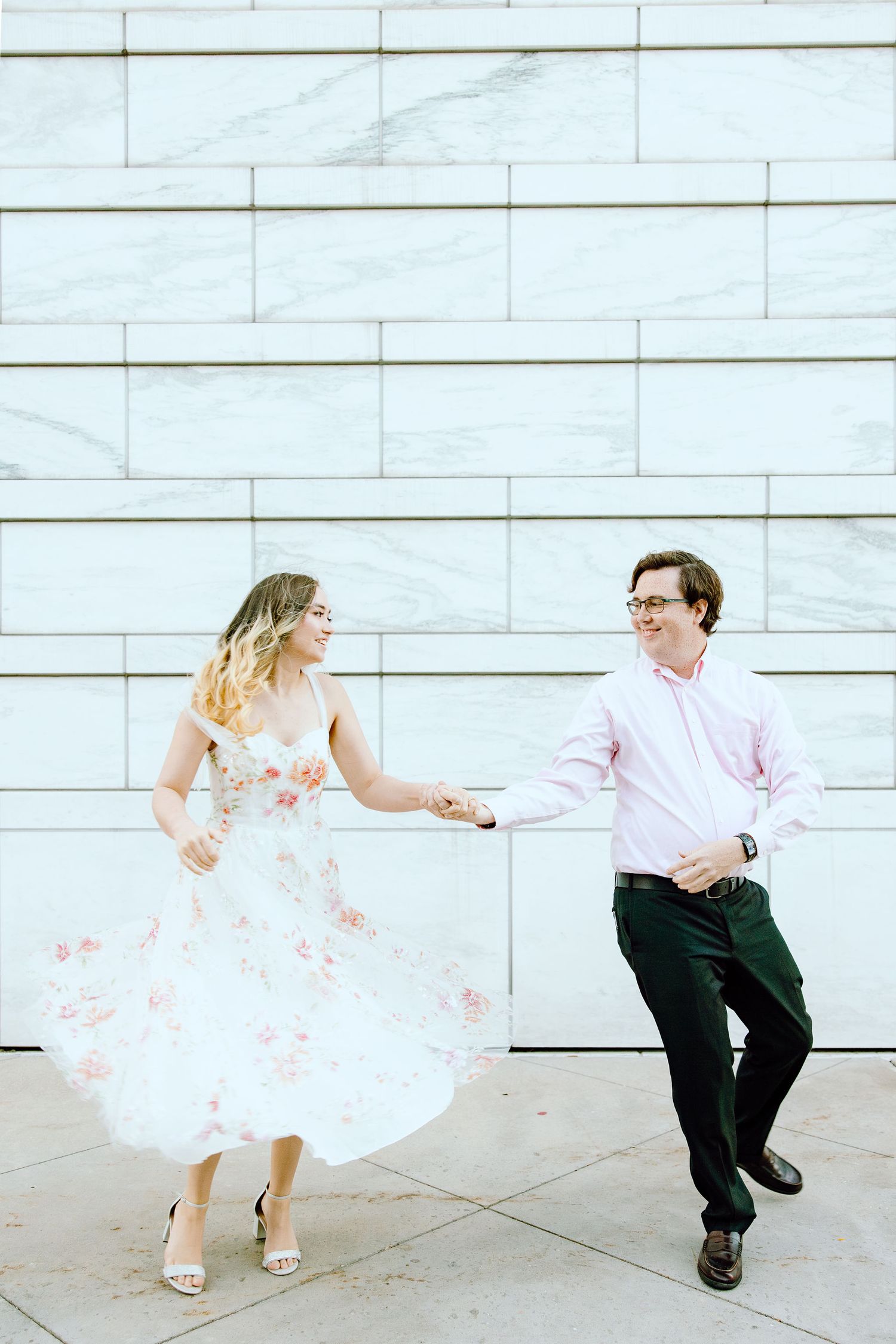 Engaged couple swing dancing at Detroit Institute of Arts engagement session in Detroit, MI