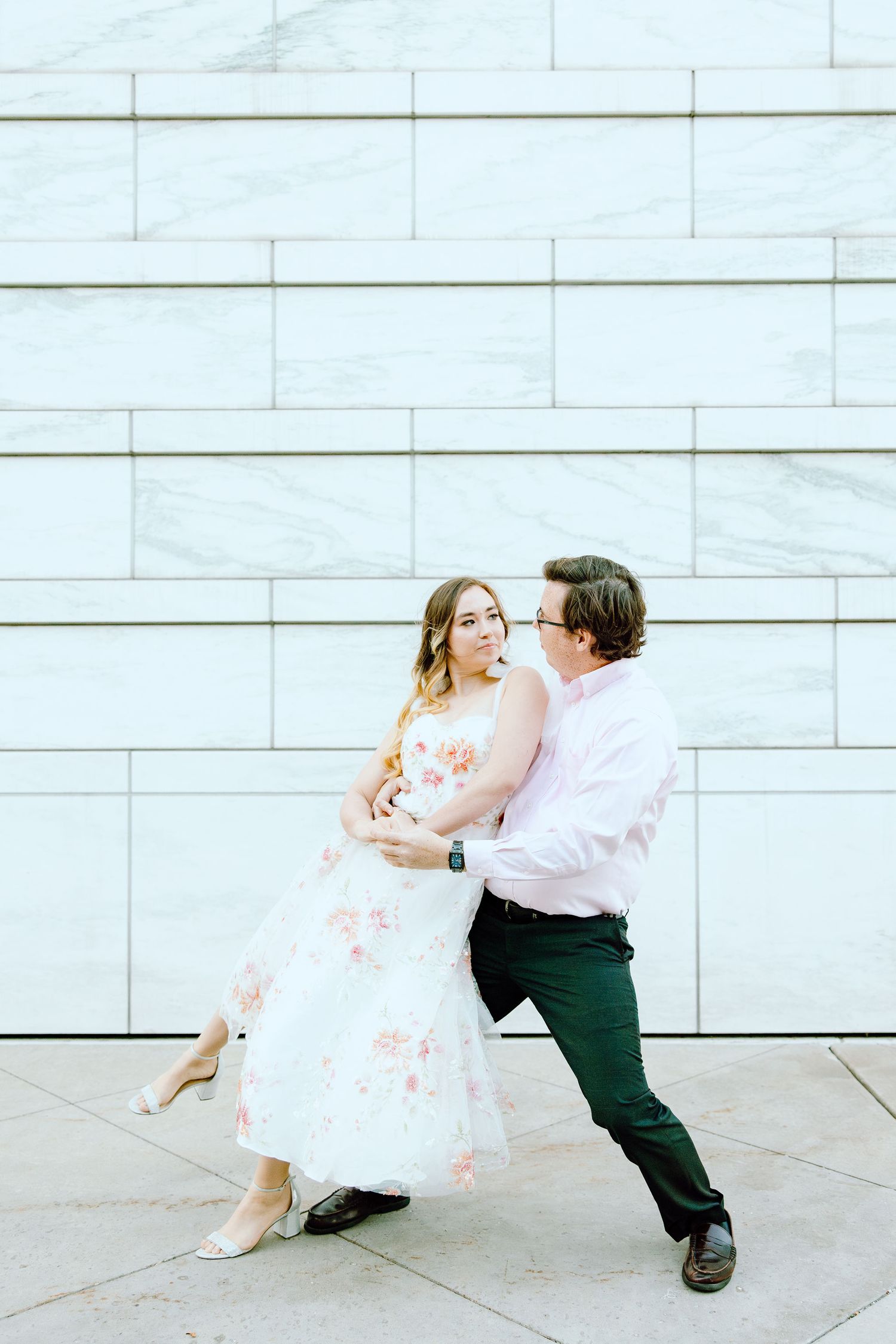 Engaged couple swing dancing at Detroit Institute of Arts engagement session in Detroit, MI