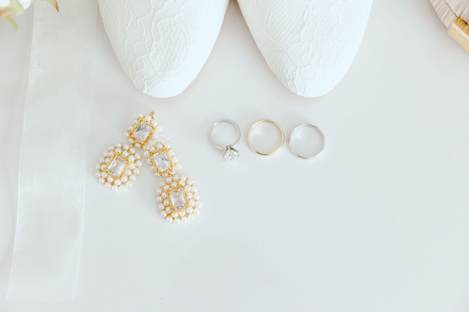 Detail photo of wedding rings and earrings at Saline, MI wedding