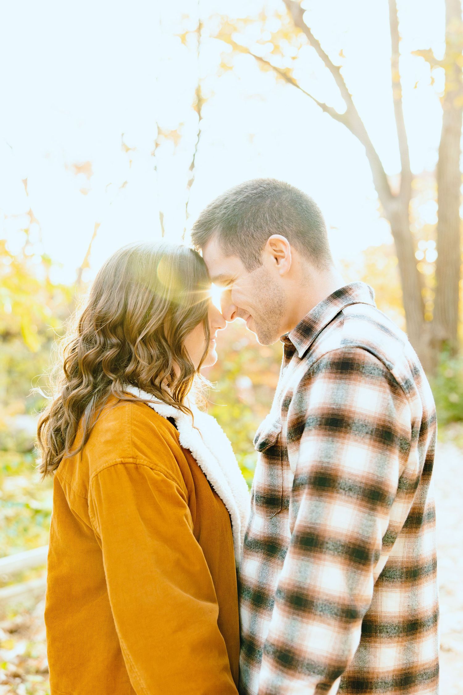 Engaged couple embracing at Nichols Arboretum fall engagement session in Ann Arbor, MI