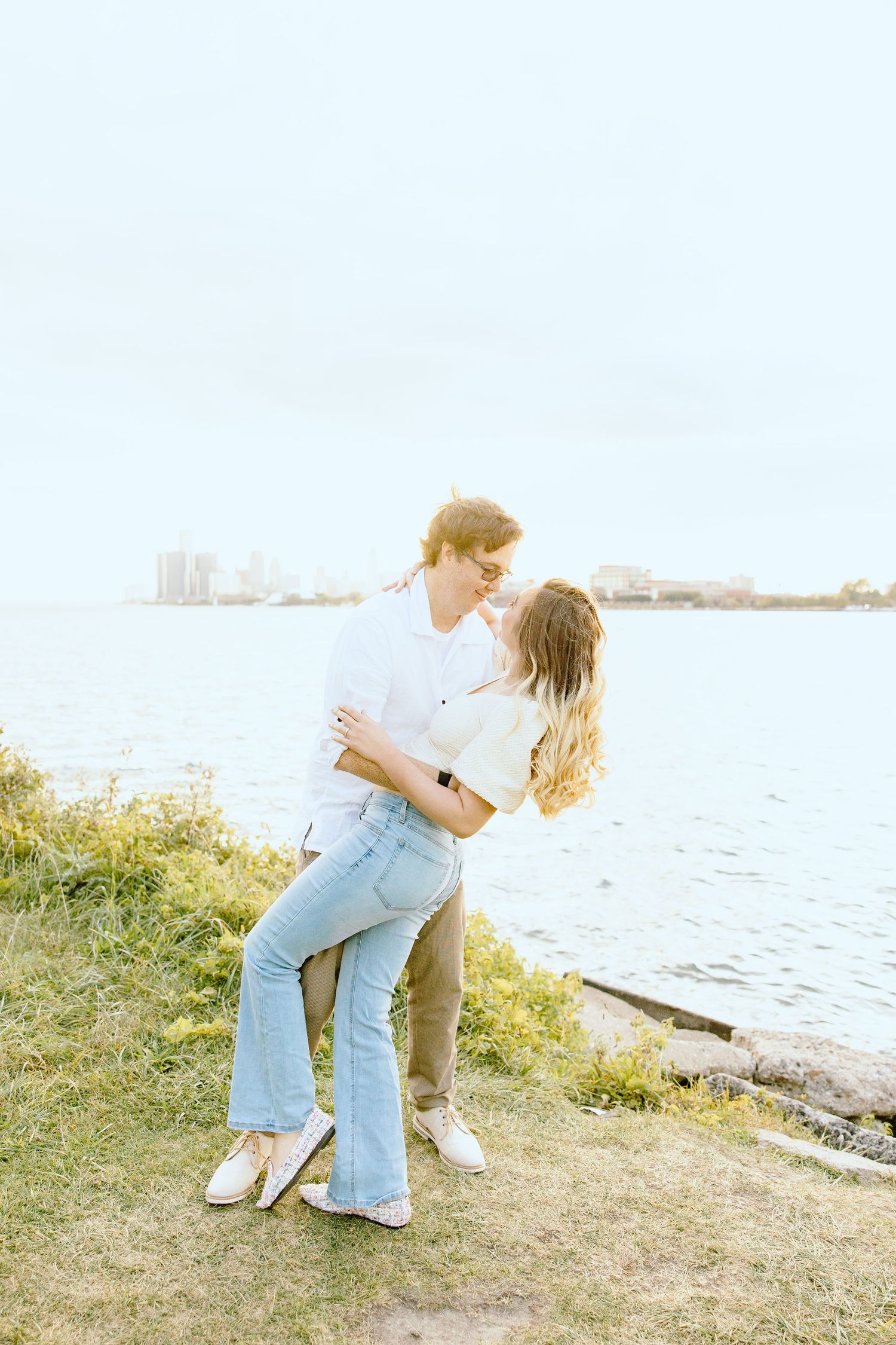 Engaged couple dipping at Belle Isle summer engagement session in Detroit, MI