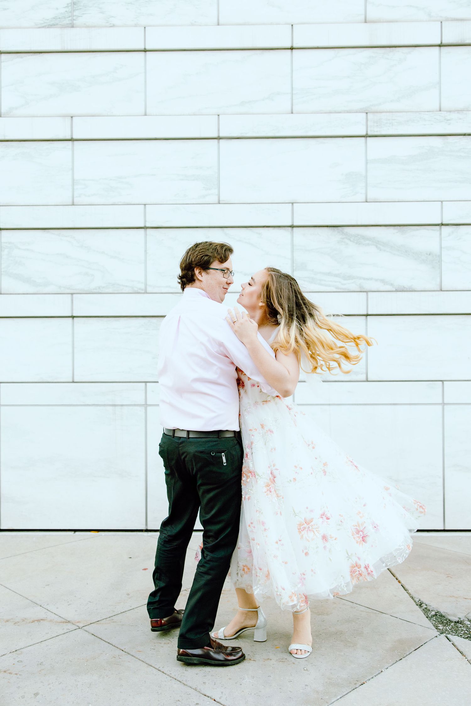 Engaged couple swing dancing at Detroit Institute of Arts engagement session in Detroit, MI