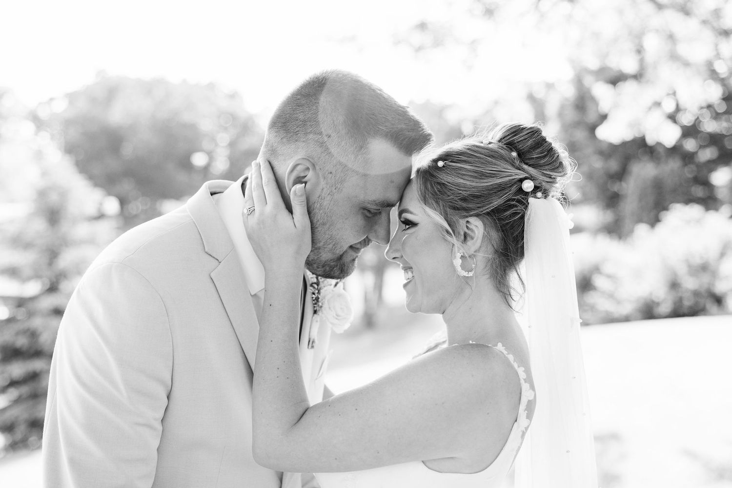 Married couple embracing at Lapeer Country Club wedding in Michigan
