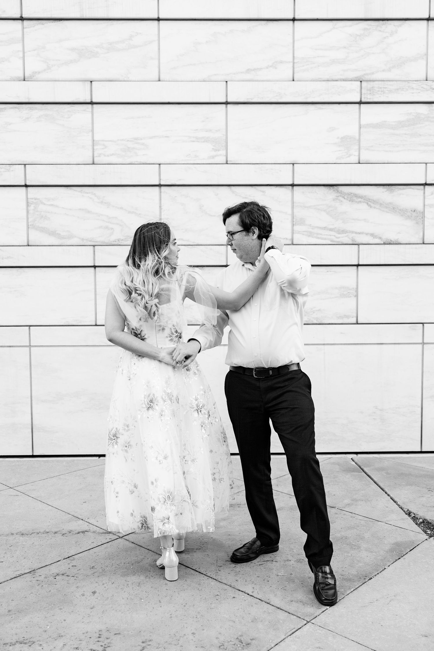 Engaged couple swing dancing at Detroit Institute of Arts engagement session in Detroit, MI