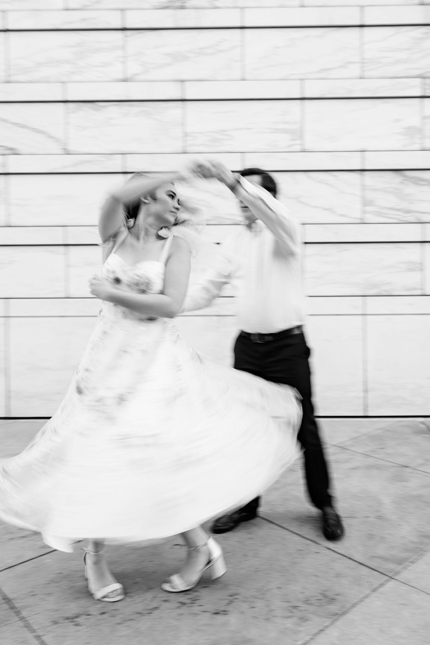 Engaged couple swing dancing at Detroit Institute of Arts engagement session in Detroit, MI