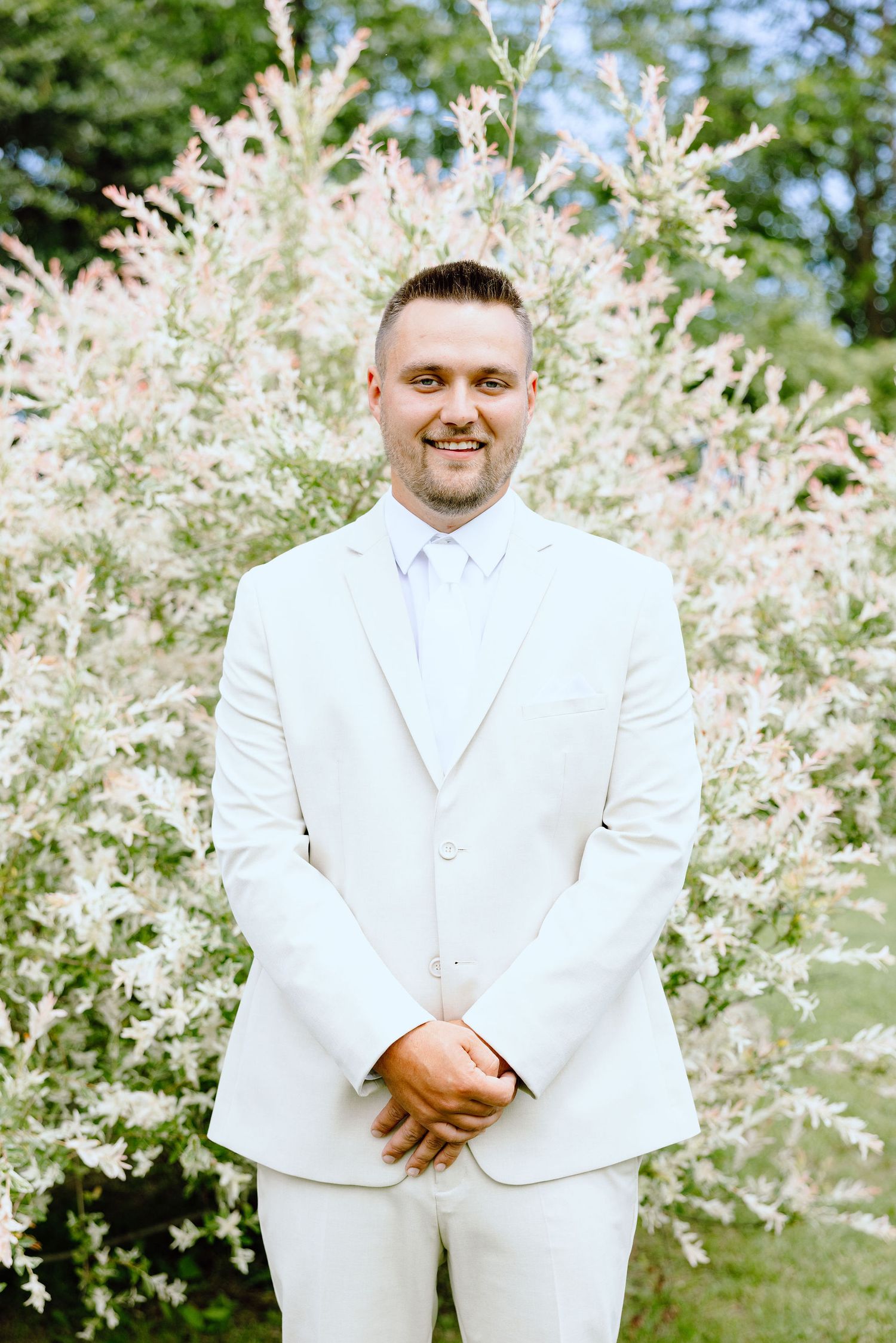 Portraits of groom at Lapeer Country Club wedding in Michigan