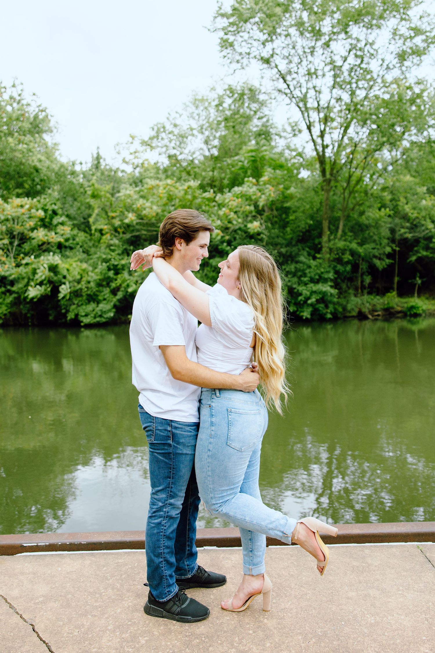 Engaged couple embracing at Greenfield Village in Dearborn, MI