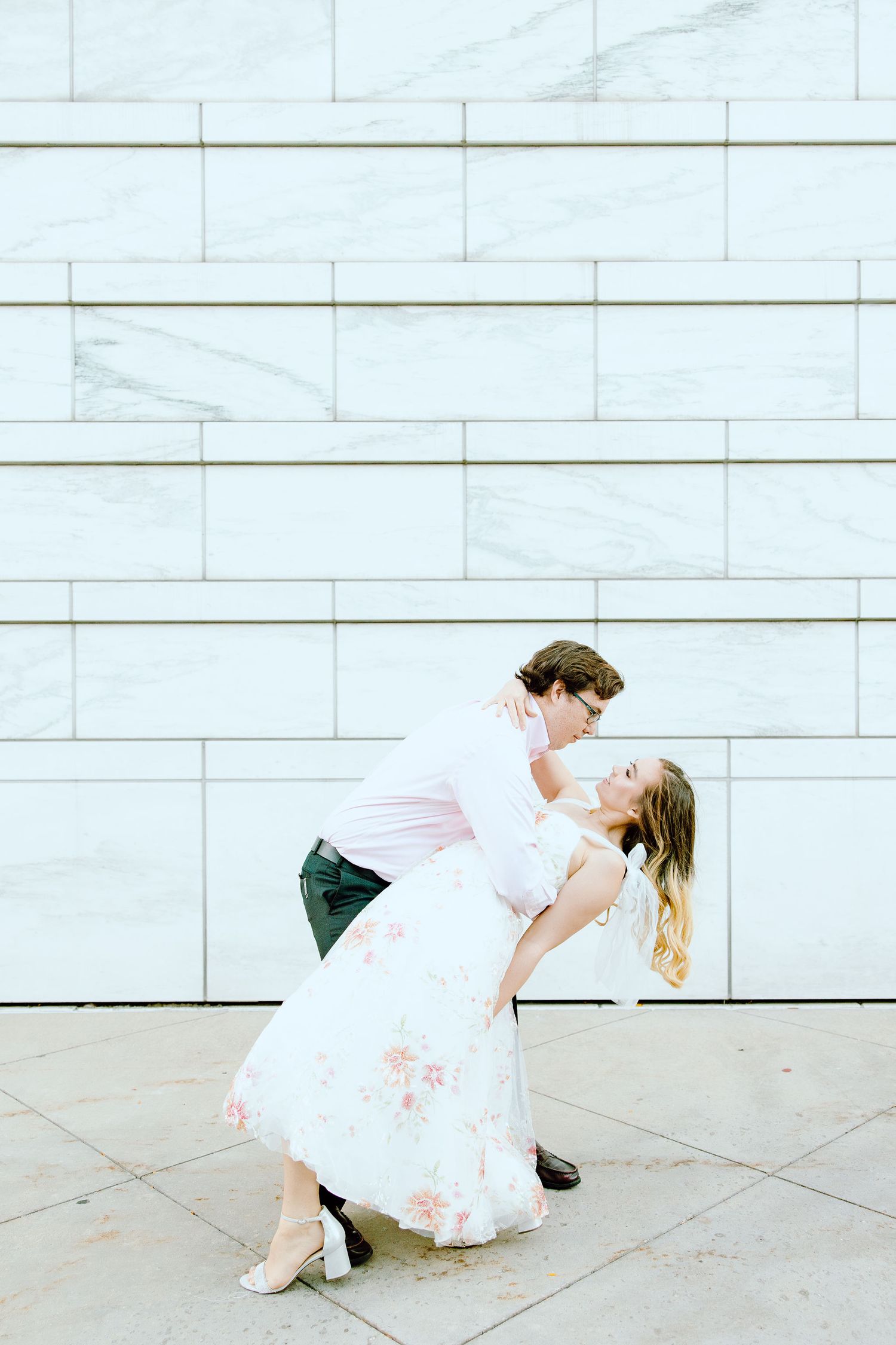 Engaged couple swing dancing at Detroit Institute of Arts engagement session in Detroit, MI