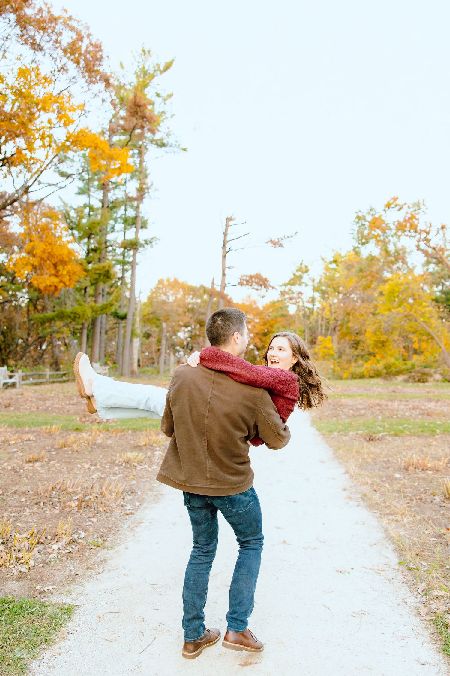 Man lifting woman at Nichols Arboretum in Ann Arbor, MI
