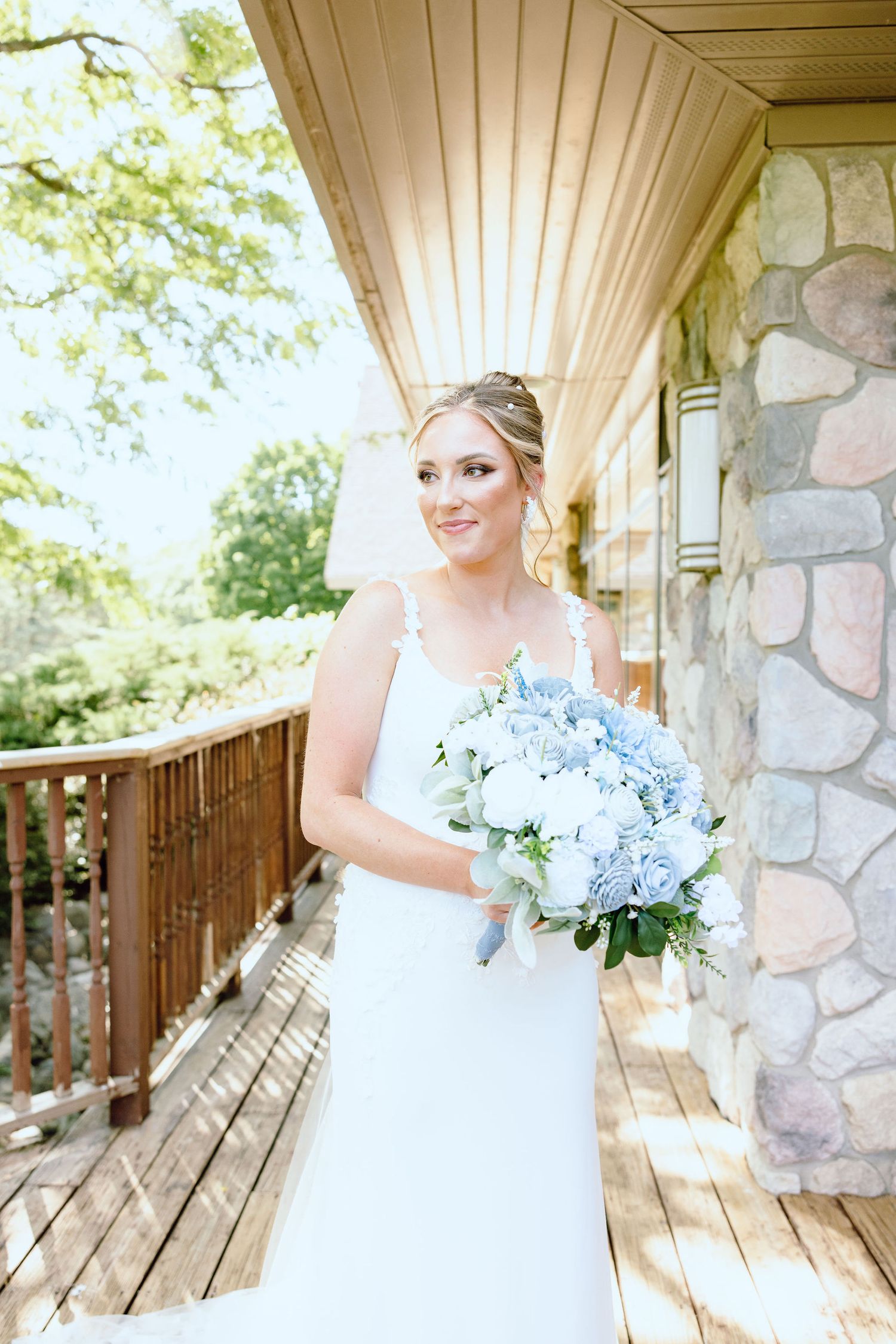 Bride holding bouquet at Lapeer Country Club wedding in Michigan