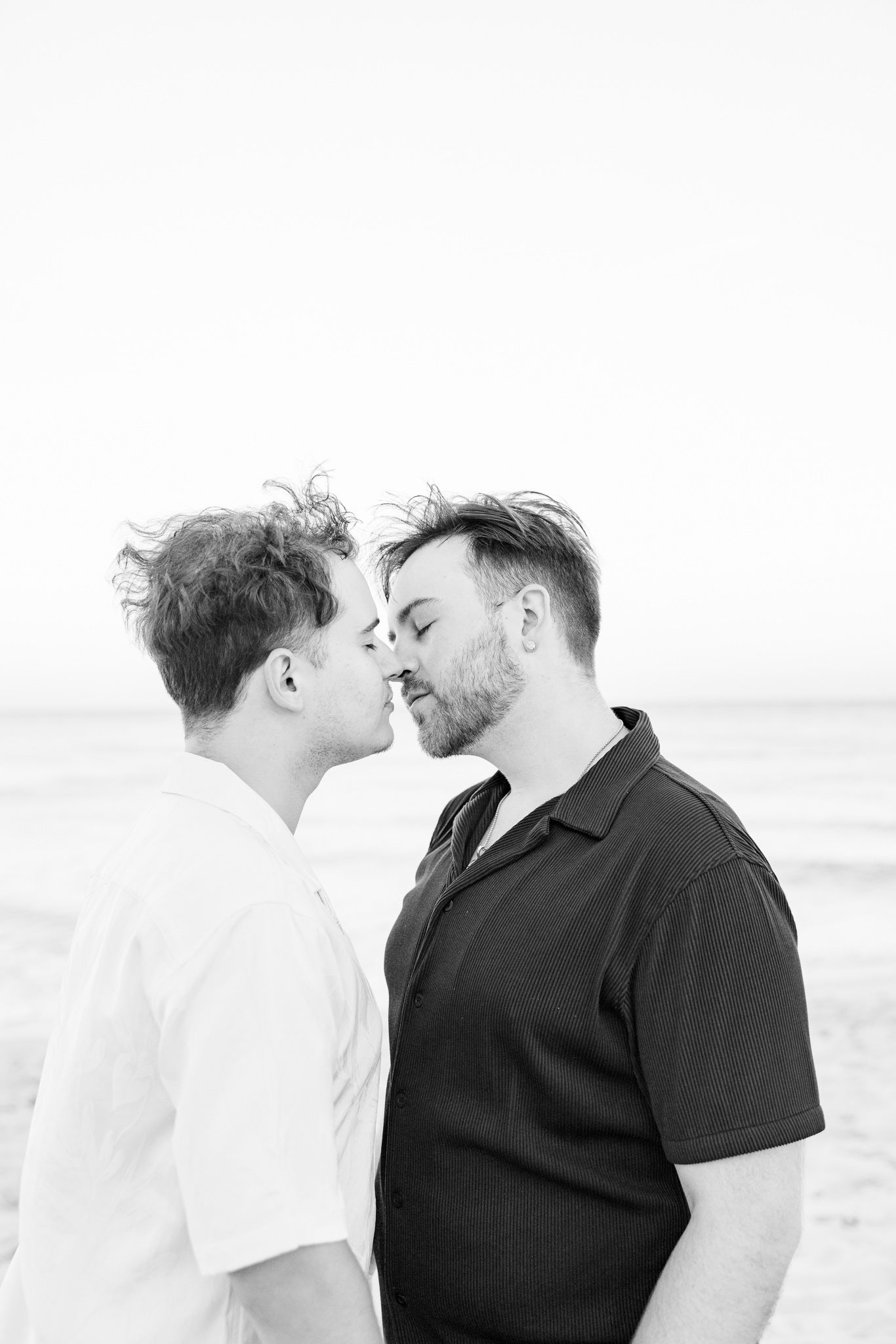 LGBTQ+ couple kissing on North Miami Beach in Florida