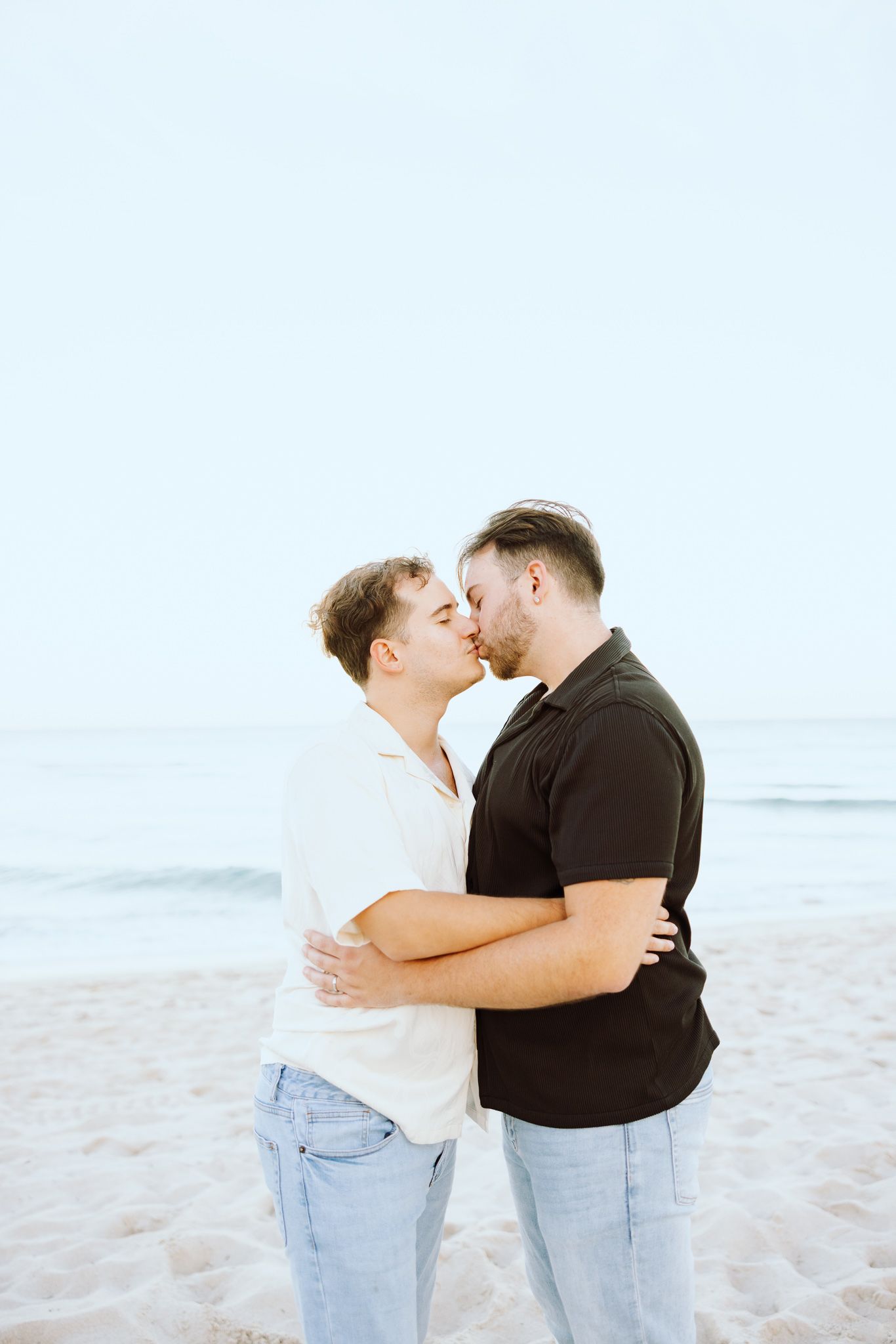 LGBTQ+ couple kissing on North Miami Beach in Florida