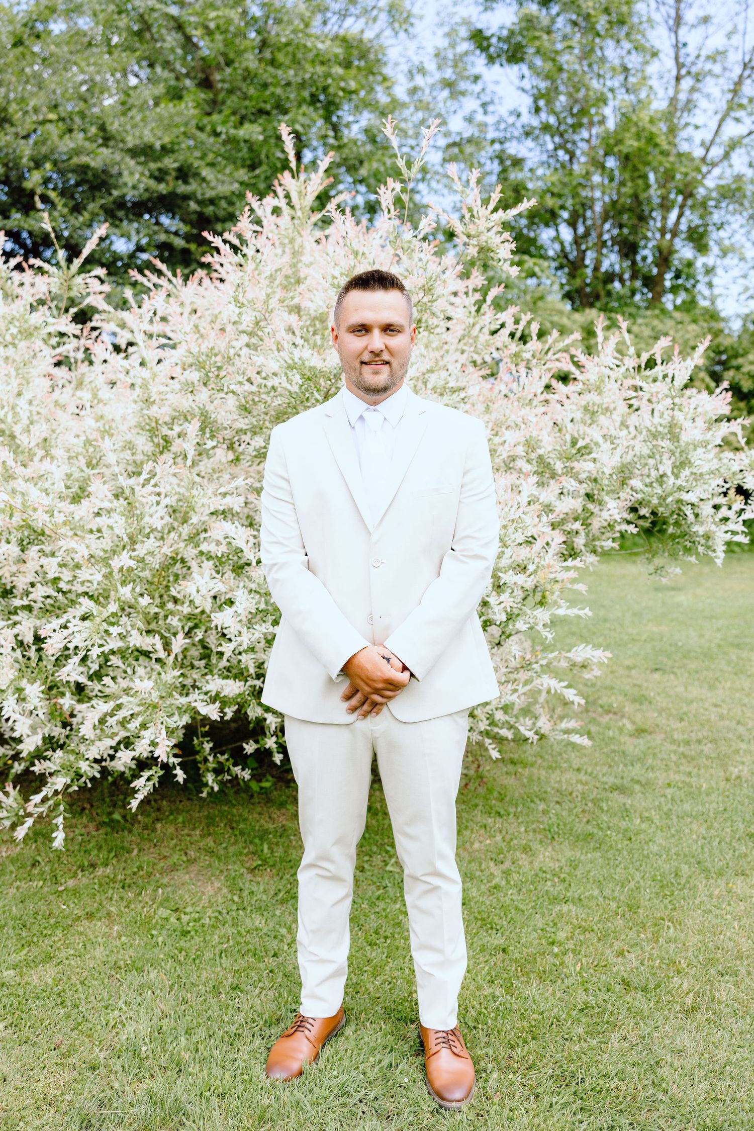 Portraits of groom at Lapeer Country Club wedding in Michigan