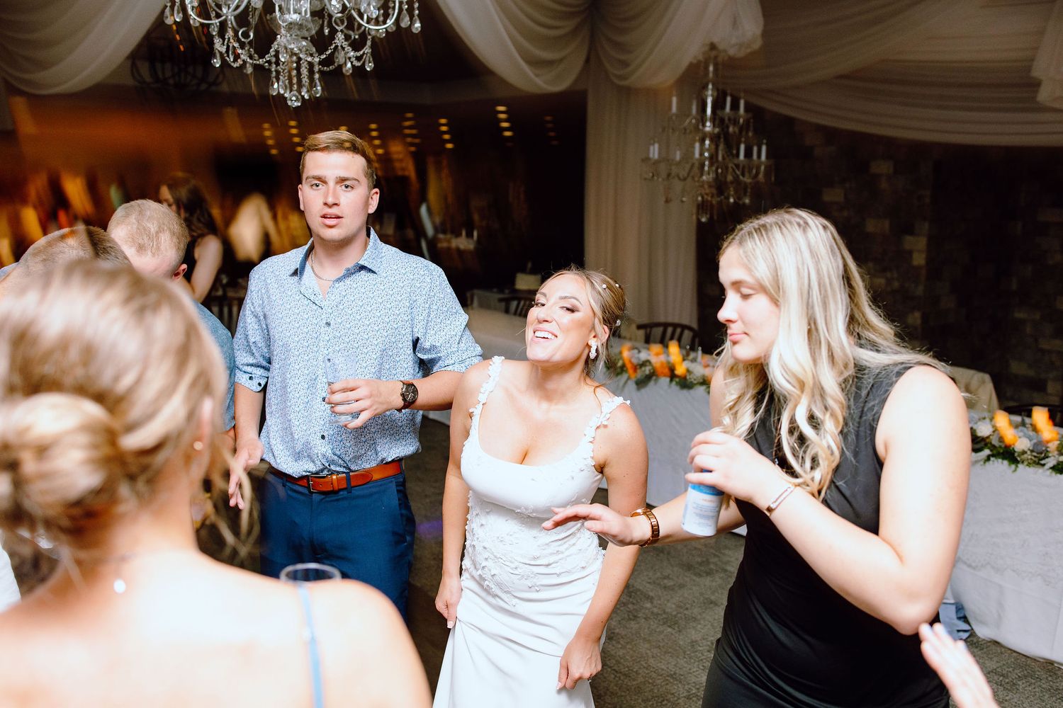 Bride dancing during reception at Lapeer Country Club wedding in Michigan