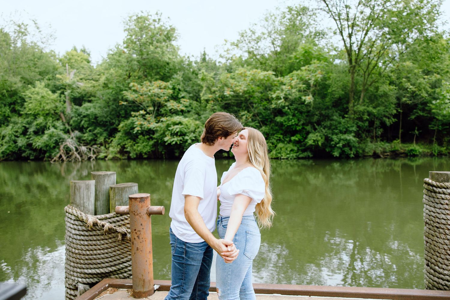 Engaged couple kissing at Greenfield Village in Dearborn, MI