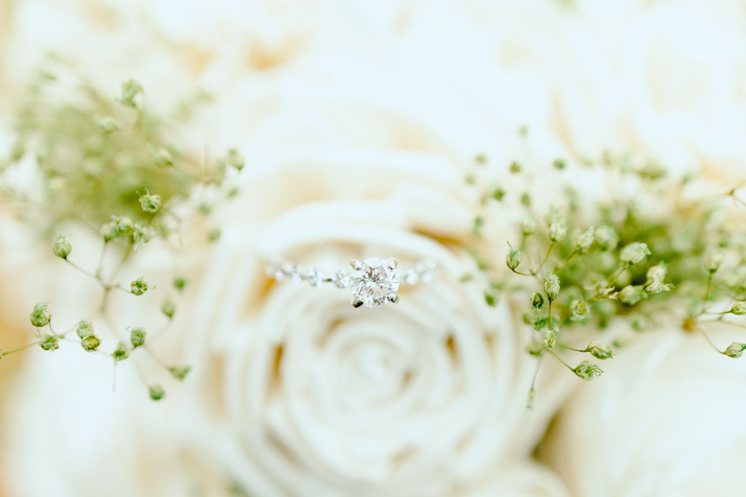 Detail photo of ring inside bouquet at Wayne, MI church wedding