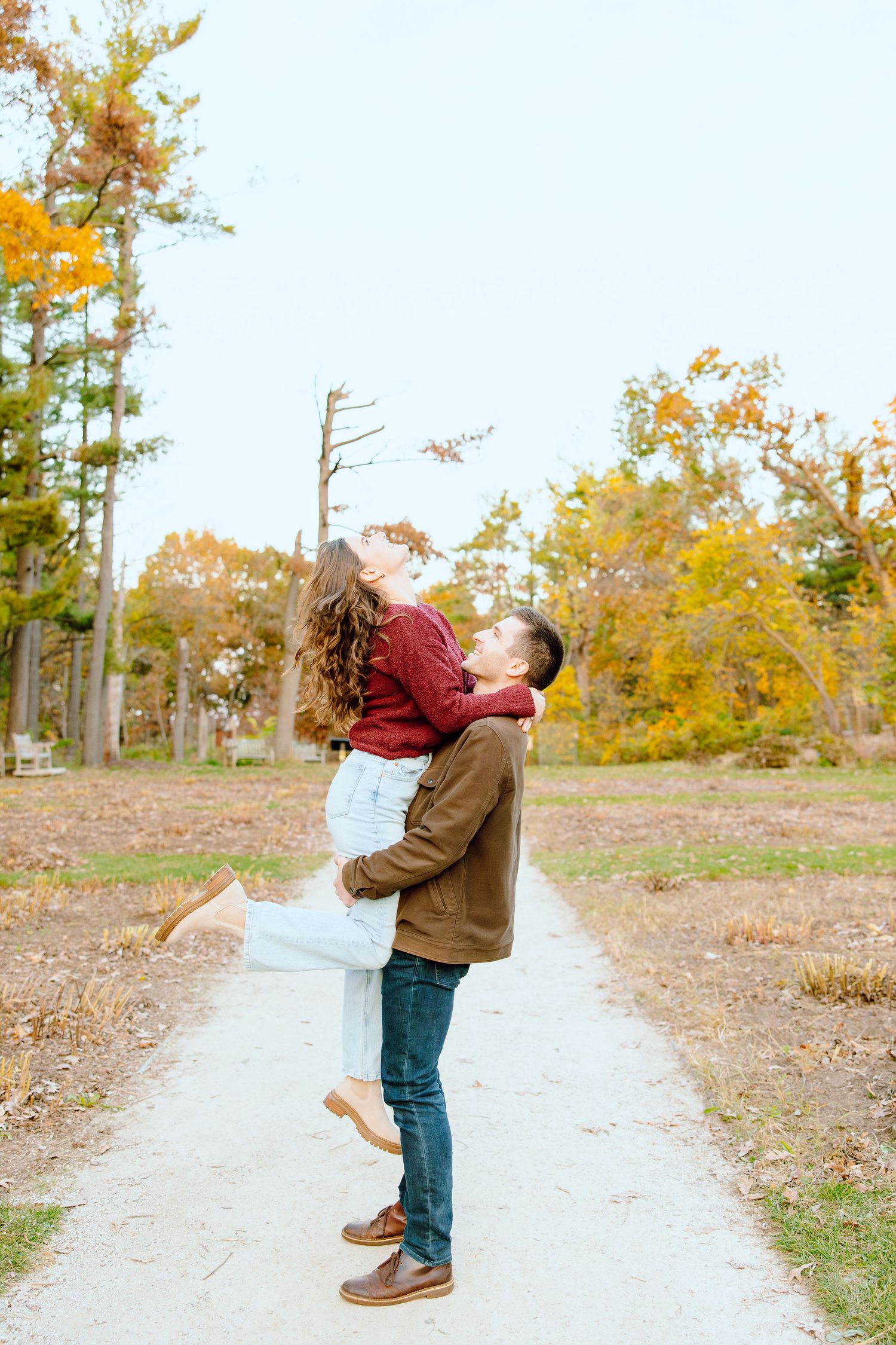 Man lifting woman at Nichols Arboretum in Ann Arbor, MI