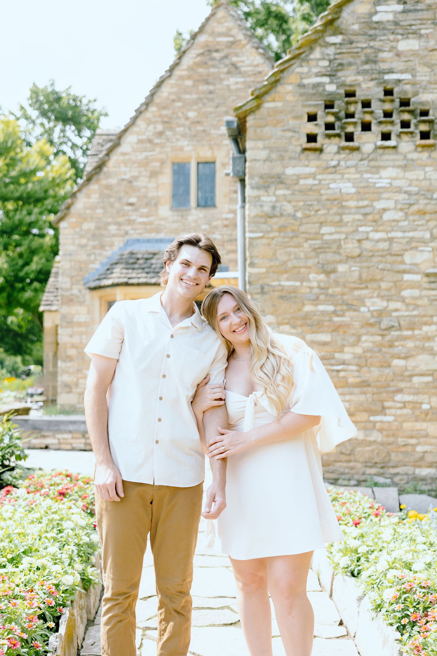 Engaged couple embracing at Greenfield Village in Dearborn, MI