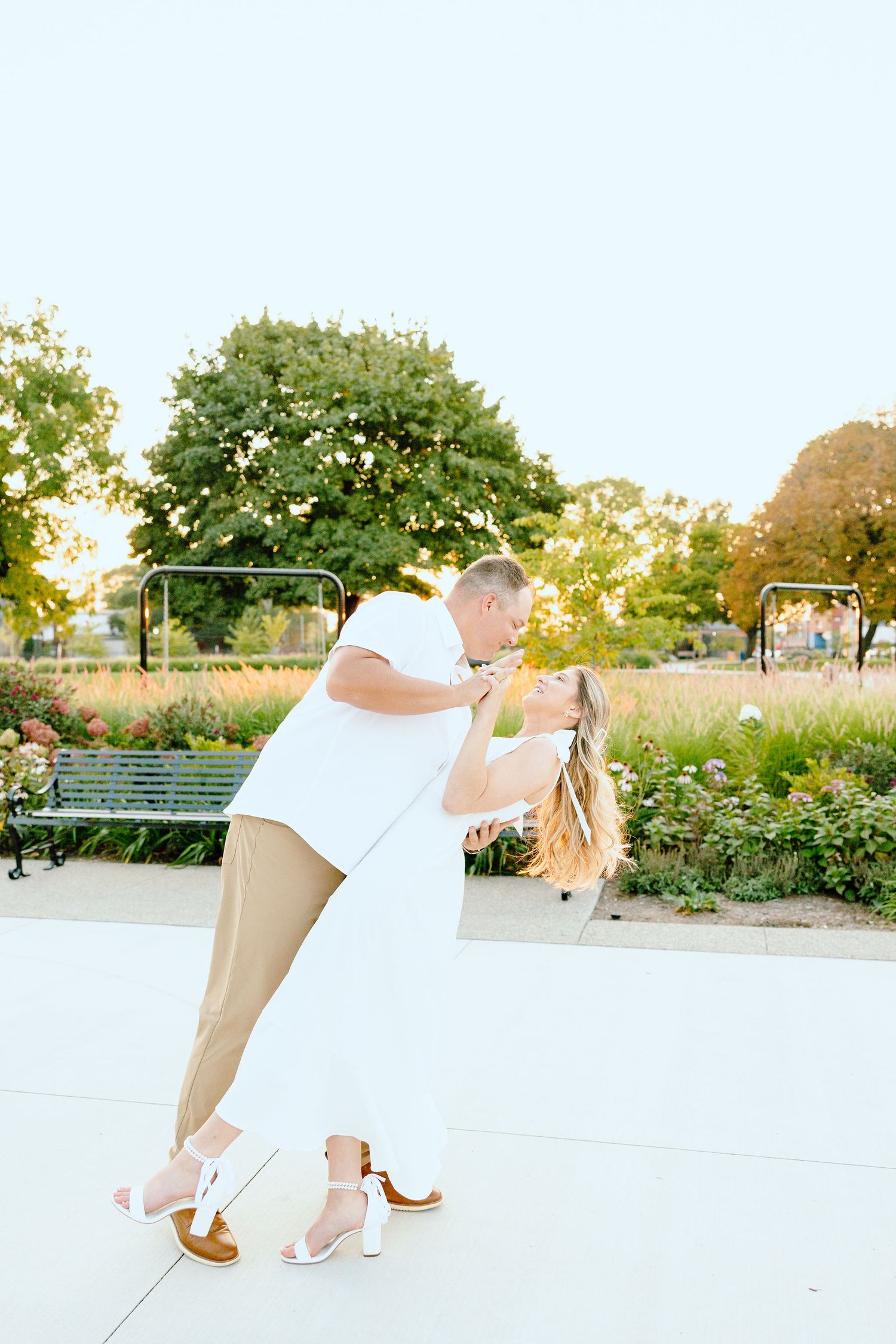 Engaged couple dipping at Michigan Central Station summer engagement session in Detroit, MI