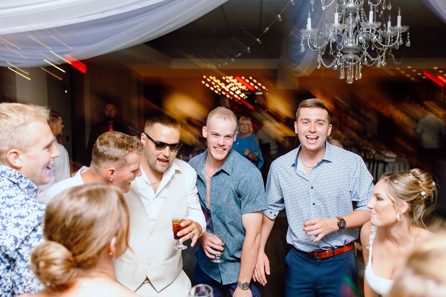 Groom dancing during reception at Lapeer Country Club wedding in Michigan