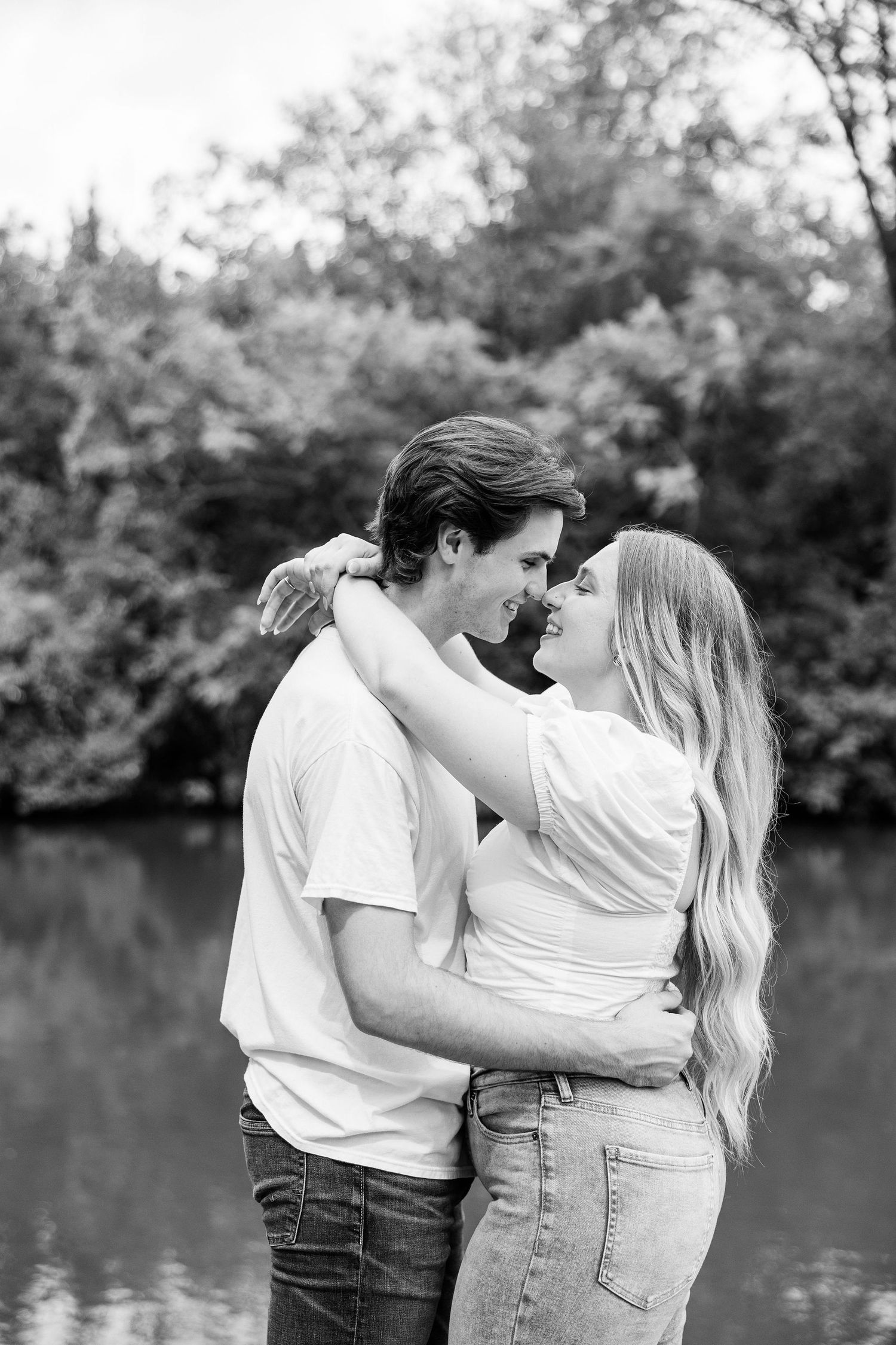 Engaged couple embracing at Greenfield Village in Dearborn, MI