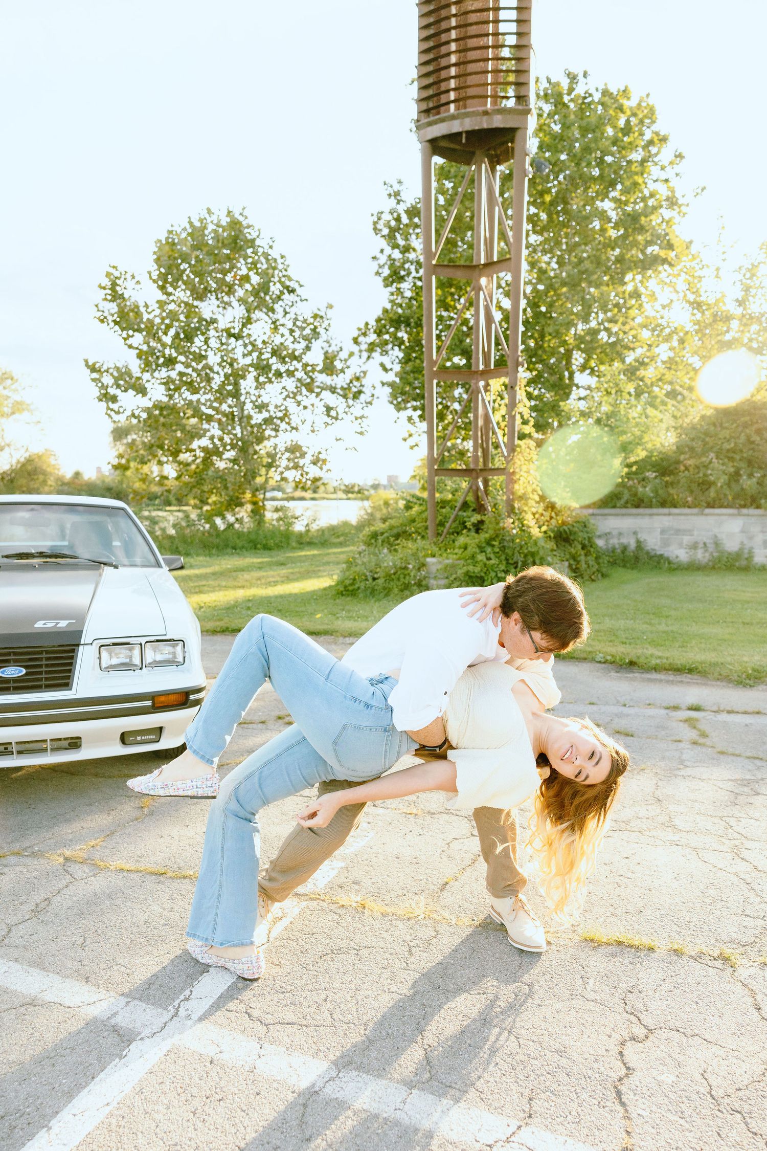 Engaged couple swing dancing at Belle Isle summer engagement session in Detroit, MI