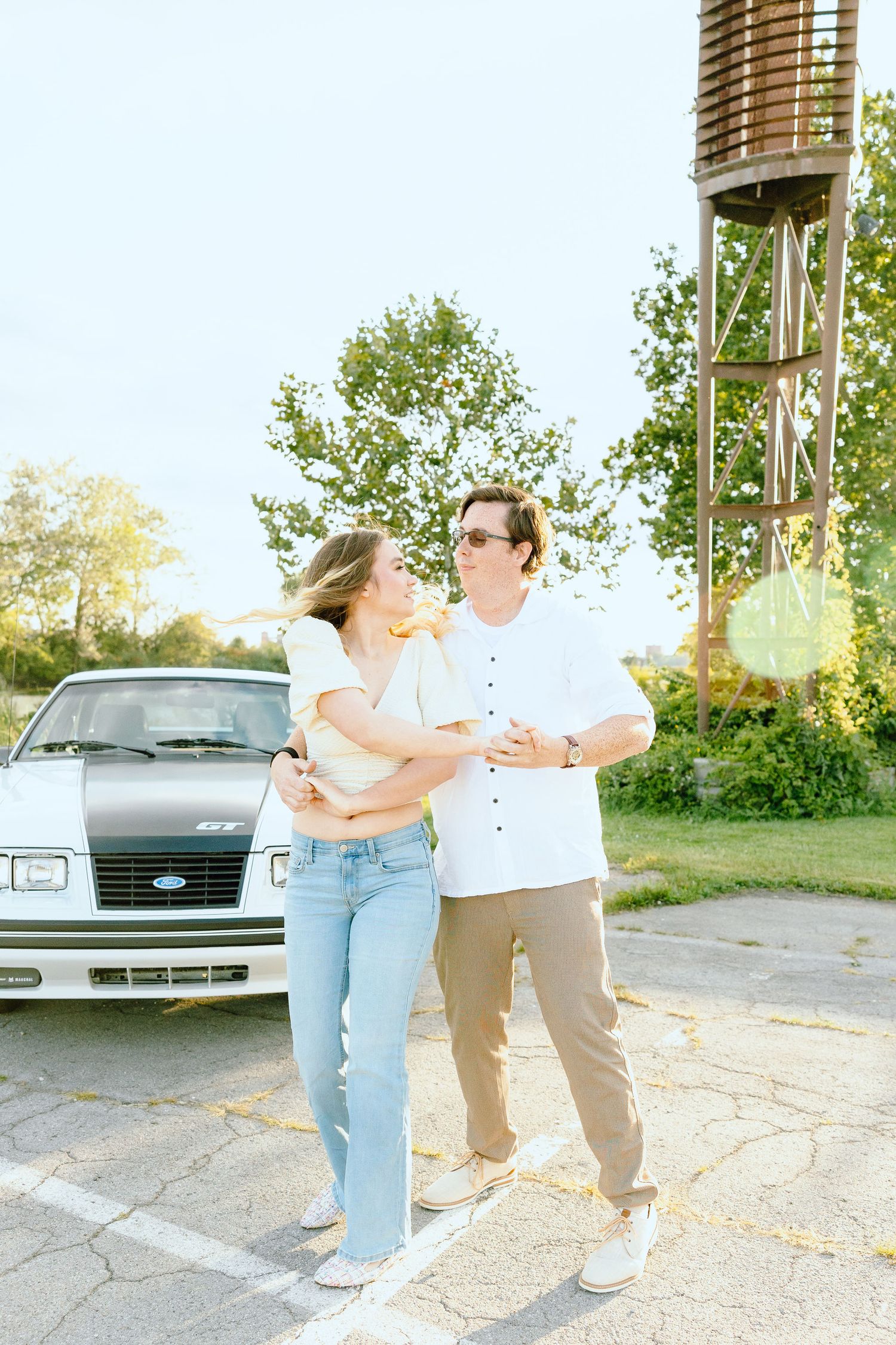 Engaged couple swing dancing at Belle Isle summer engagement session in Detroit, MI