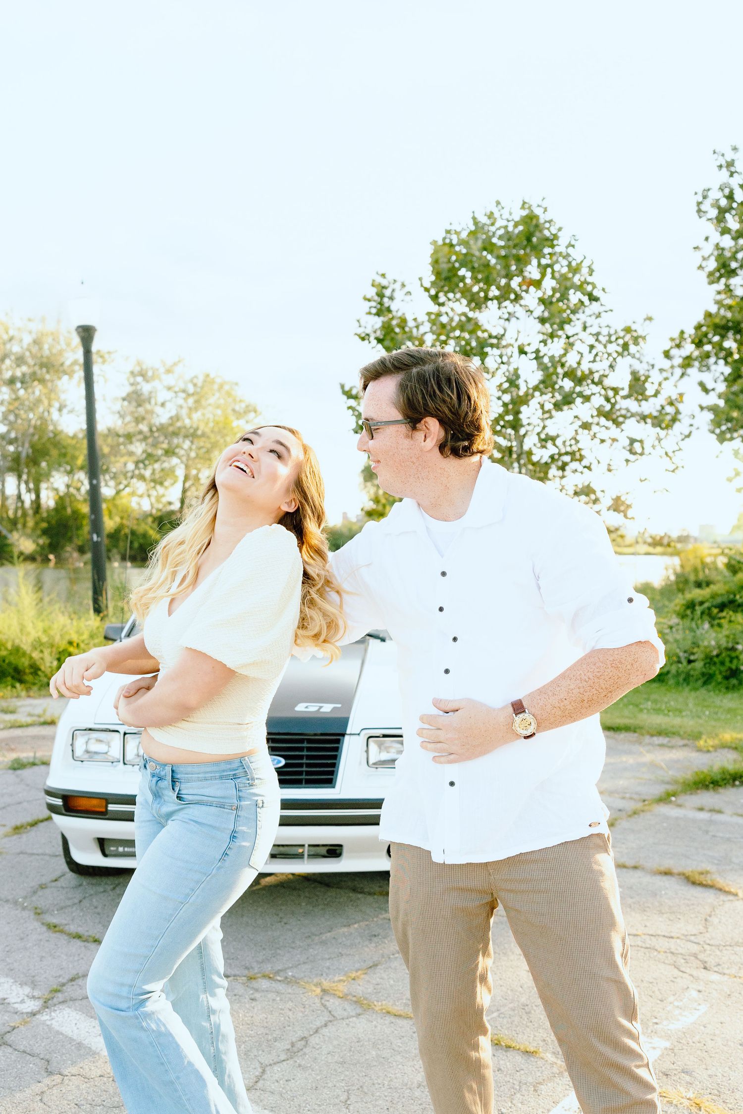 Engaged couple swing dancing at Belle Isle summer engagement session in Detroit, MI