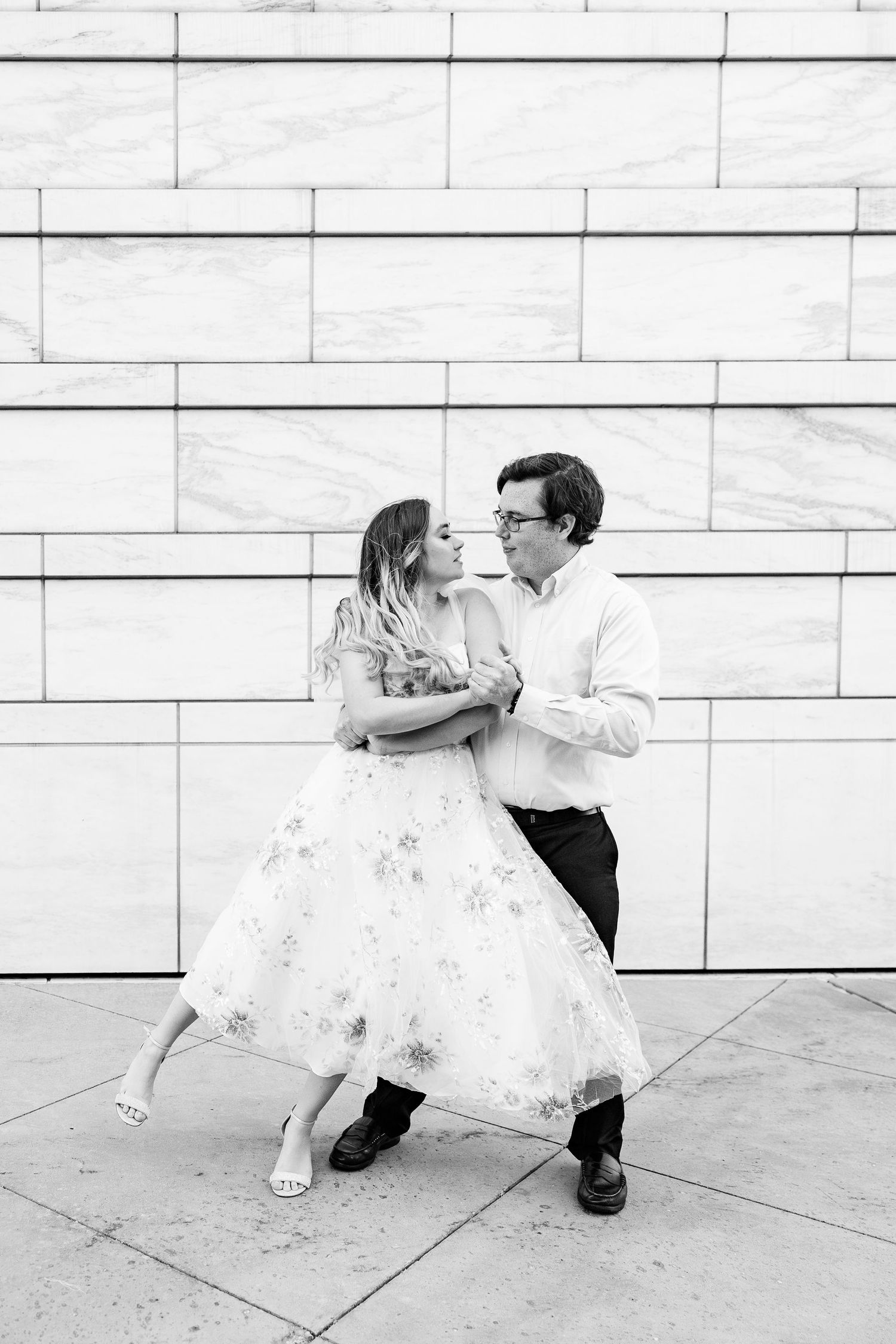 Engaged couple swing dancing at Detroit Institute of Arts engagement session in Detroit, MI