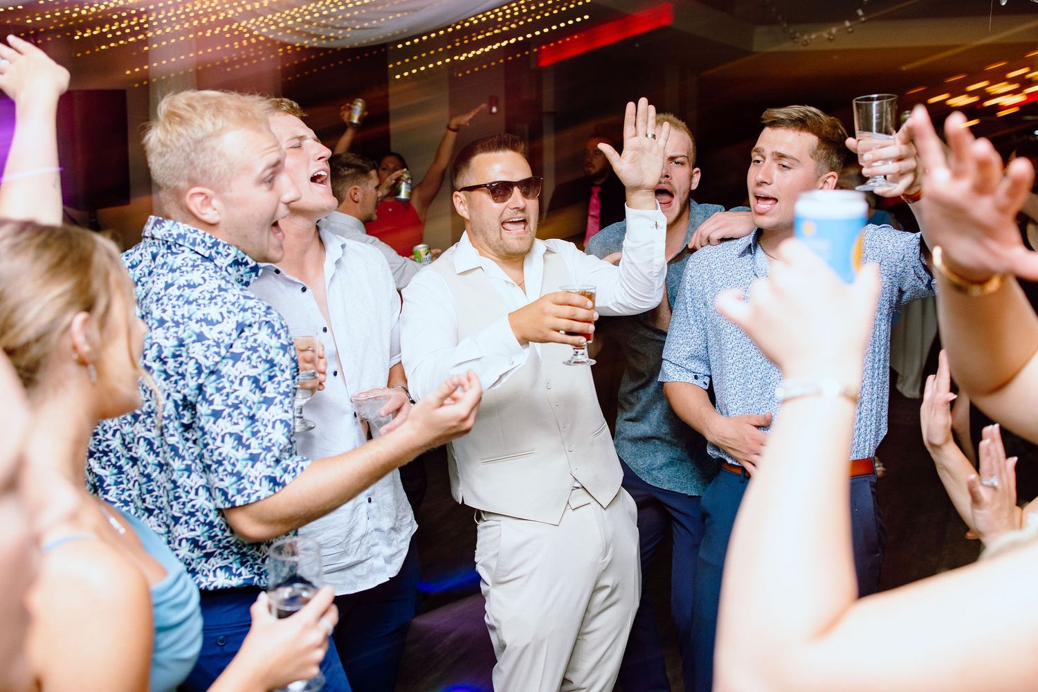 Groom dancing during reception at Lapeer Country Club wedding in Michigan