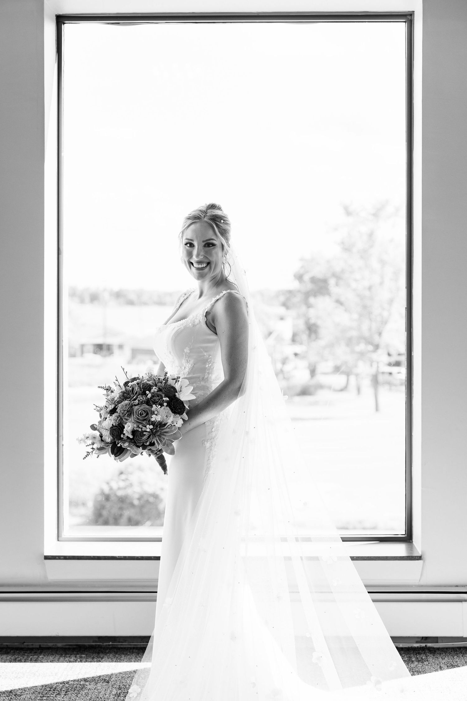 Bride portrait in front of window at Lapeer Country Club wedding in Michigan