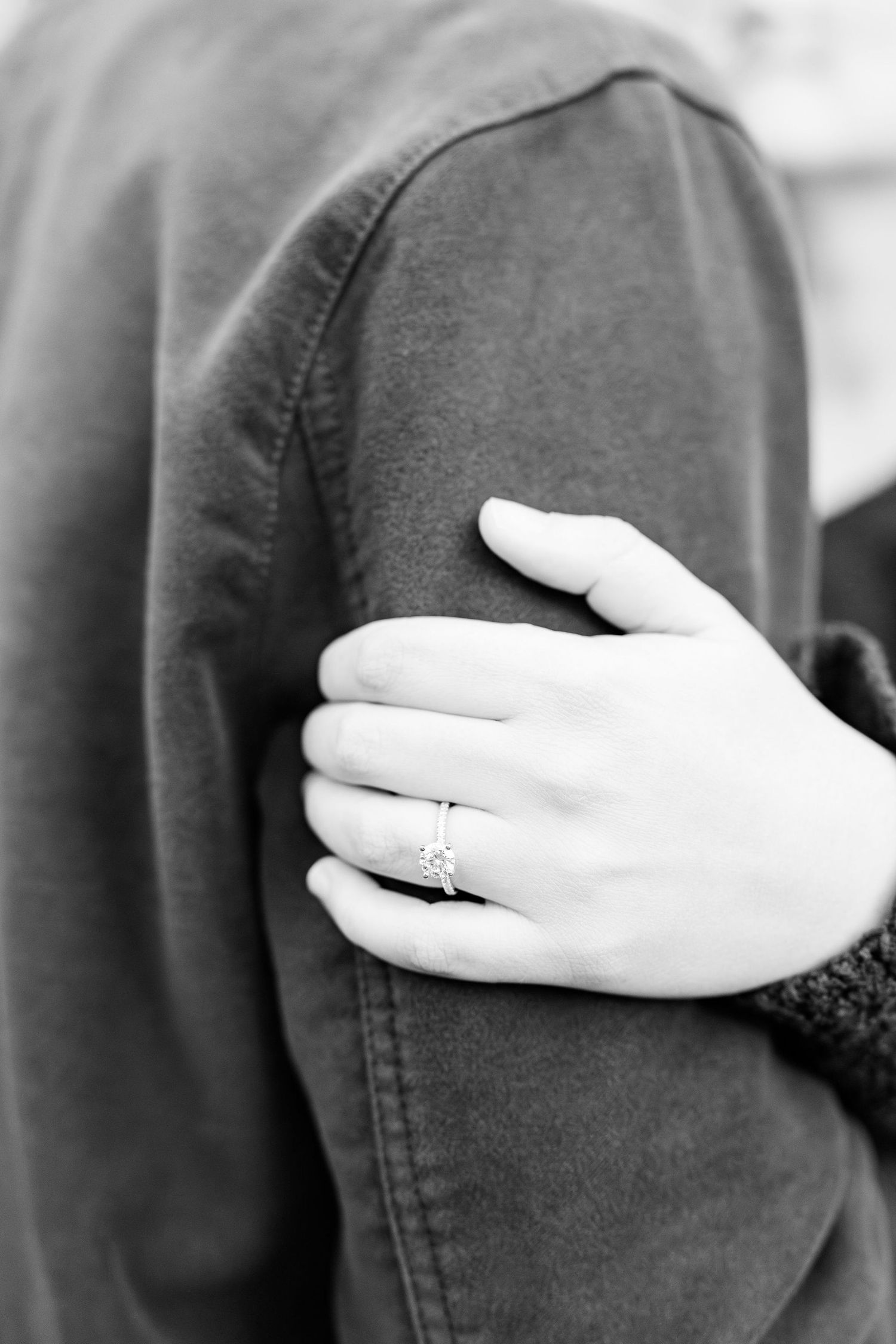 Detail photo of engagement ring at Nichols Arboretum in Ann Arbor, MI