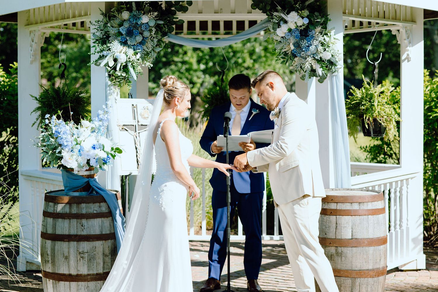 Couple exchanging rings at Lapeer Country Club wedding in Michigan