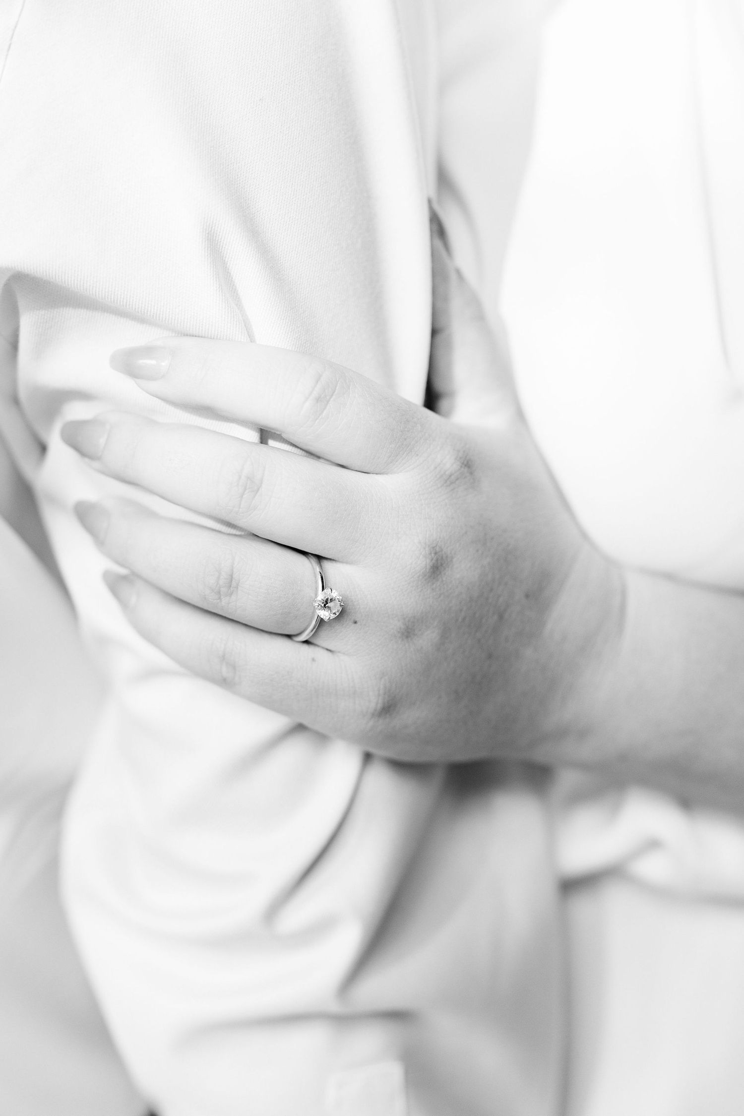 Detail photo of engagement ring at the UofM Law Quad in Ann Arbor, MI