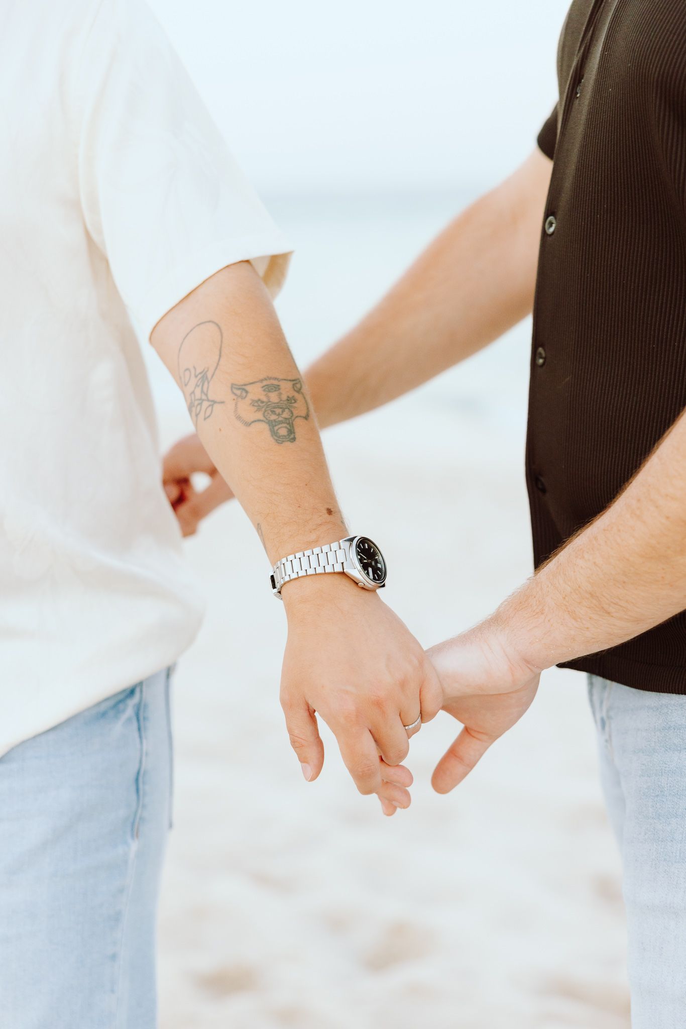 Gay couple holding hands at Miami Beach, FL couples session