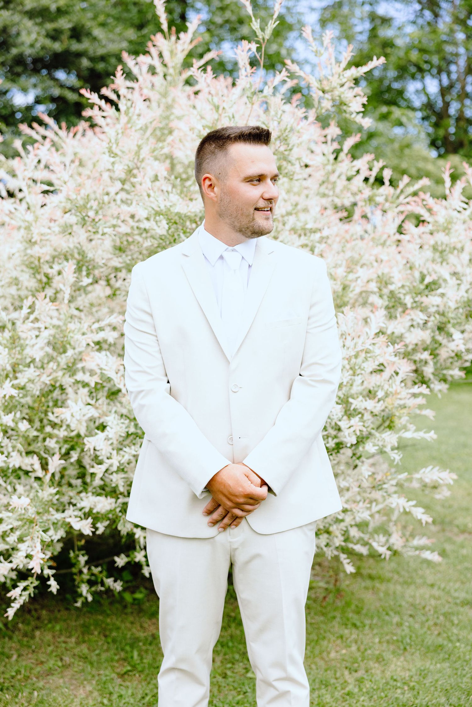 Portraits of groom at Lapeer Country Club wedding in Michigan