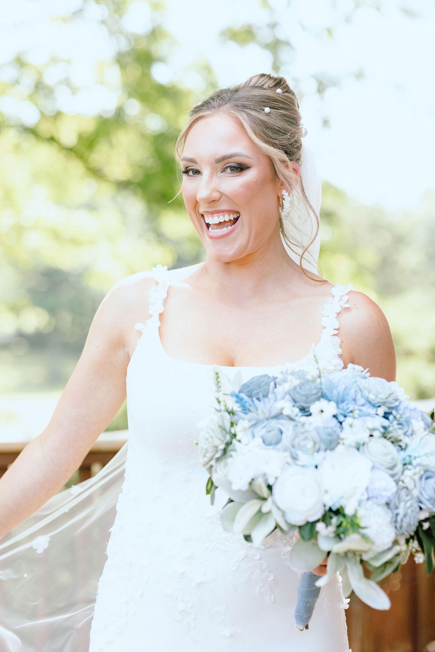 Bride holding bouquet at Lapeer Country Club wedding in Michigan