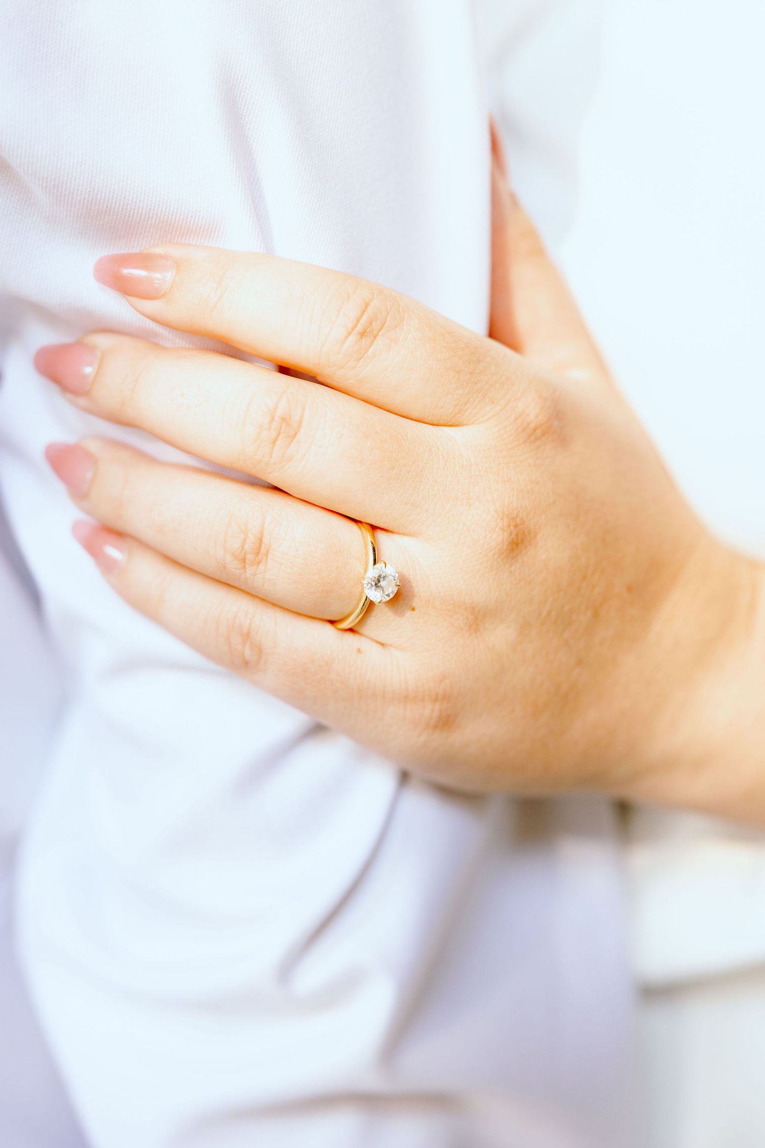 Detail photo of engagement ring at the UofM Law Quad in Ann Arbor, MI