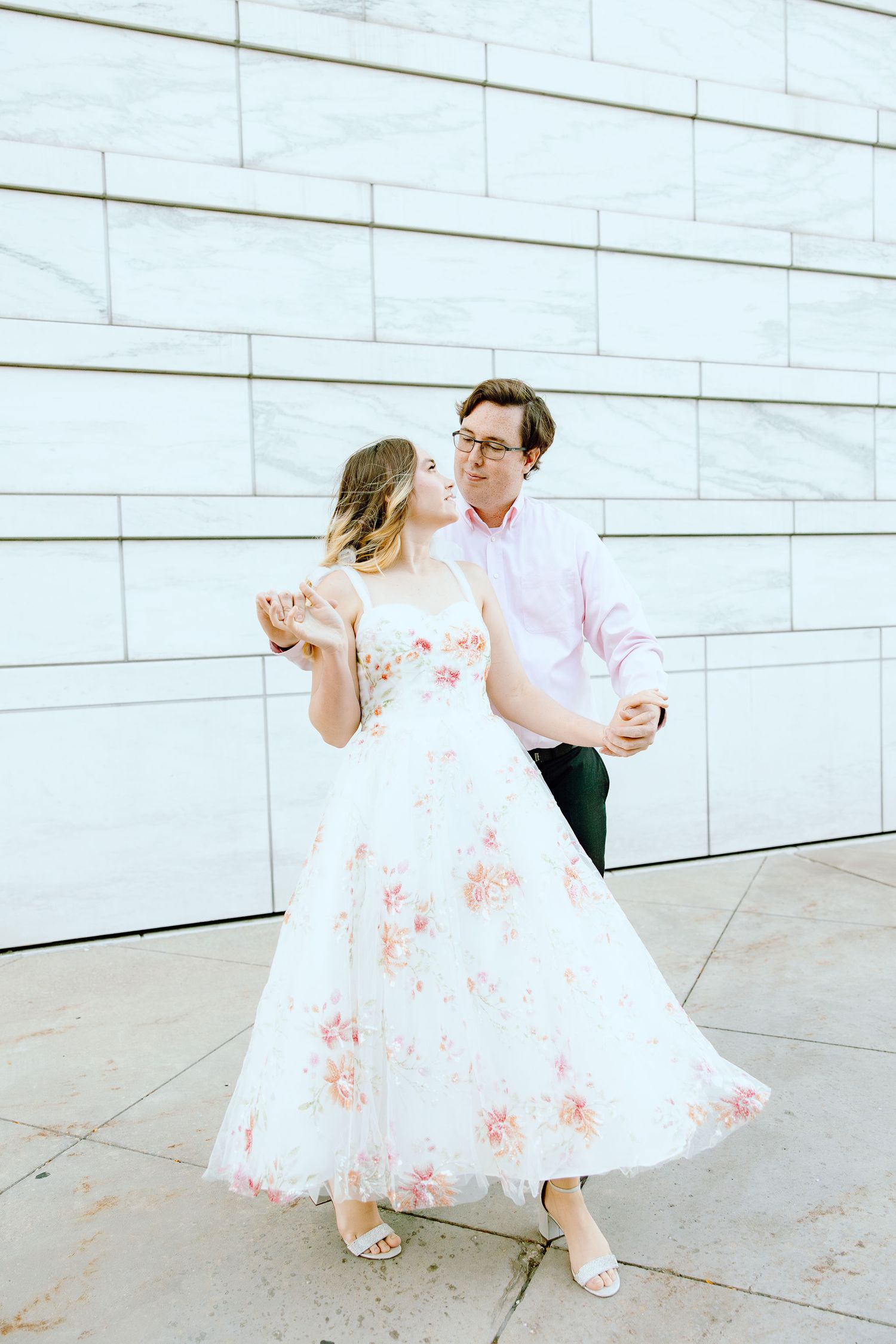Engaged couple swing dancing at Detroit Institute of Arts engagement session in Detroit, MI