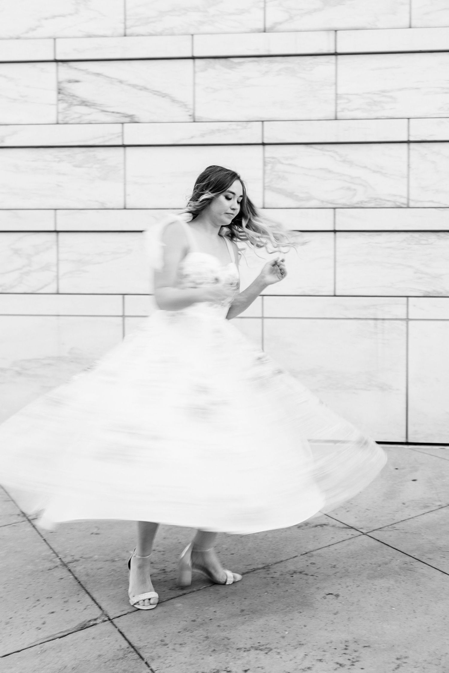 Engaged couple swing dancing at Detroit Institute of Arts engagement session in Detroit, MI