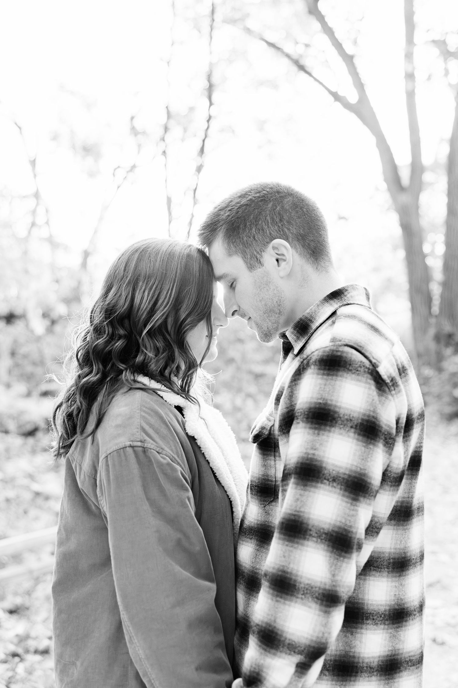 Engaged couple embracing at Nichols Arboretum fall engagement session in Ann Arbor, MI