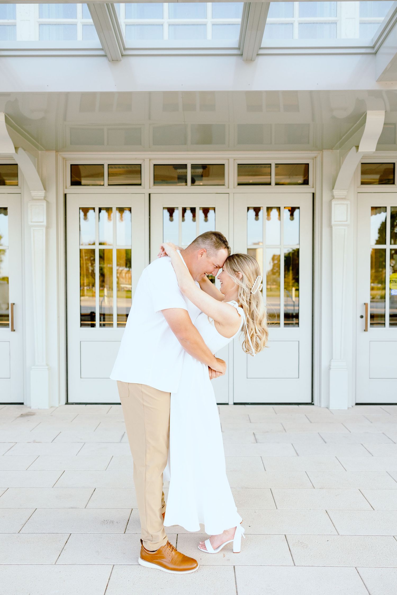 Engaged couple kissing at Michigan Central Station in Detroit, MI