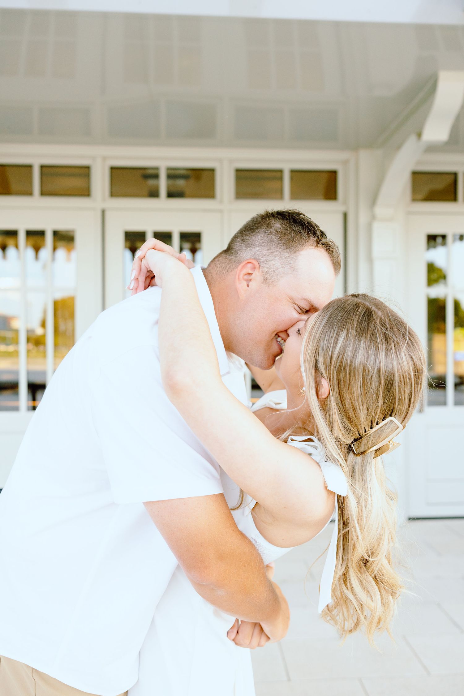 Engaged couple kissing at Michigan Central Station in Detroit, MI