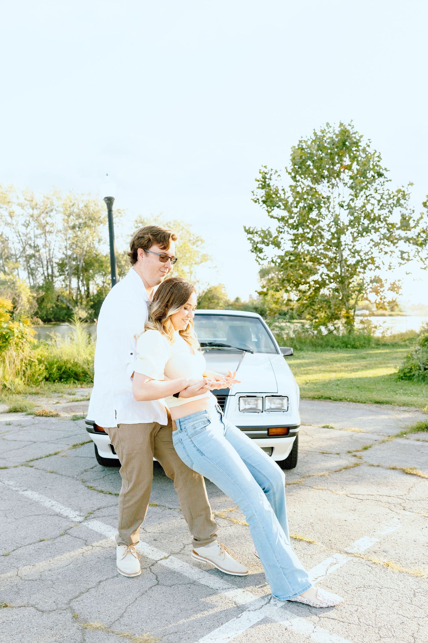 Engaged couple swing dancing at Belle Isle summer engagement session in Detroit, MI