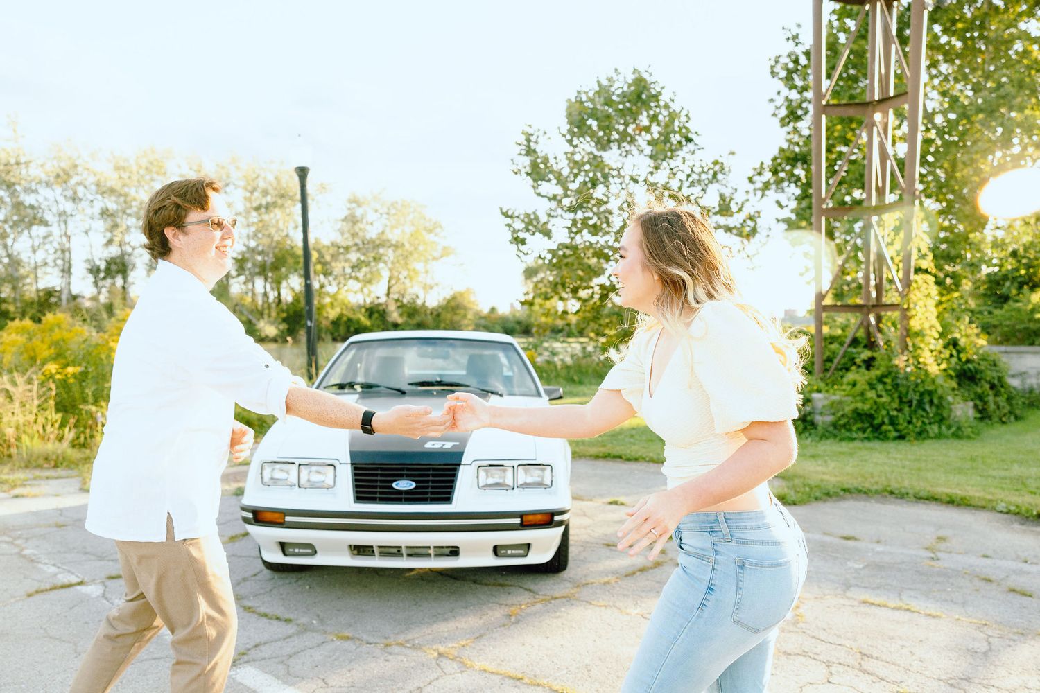 Engaged couple swing dancing at Belle Isle summer engagement session in Detroit, MI