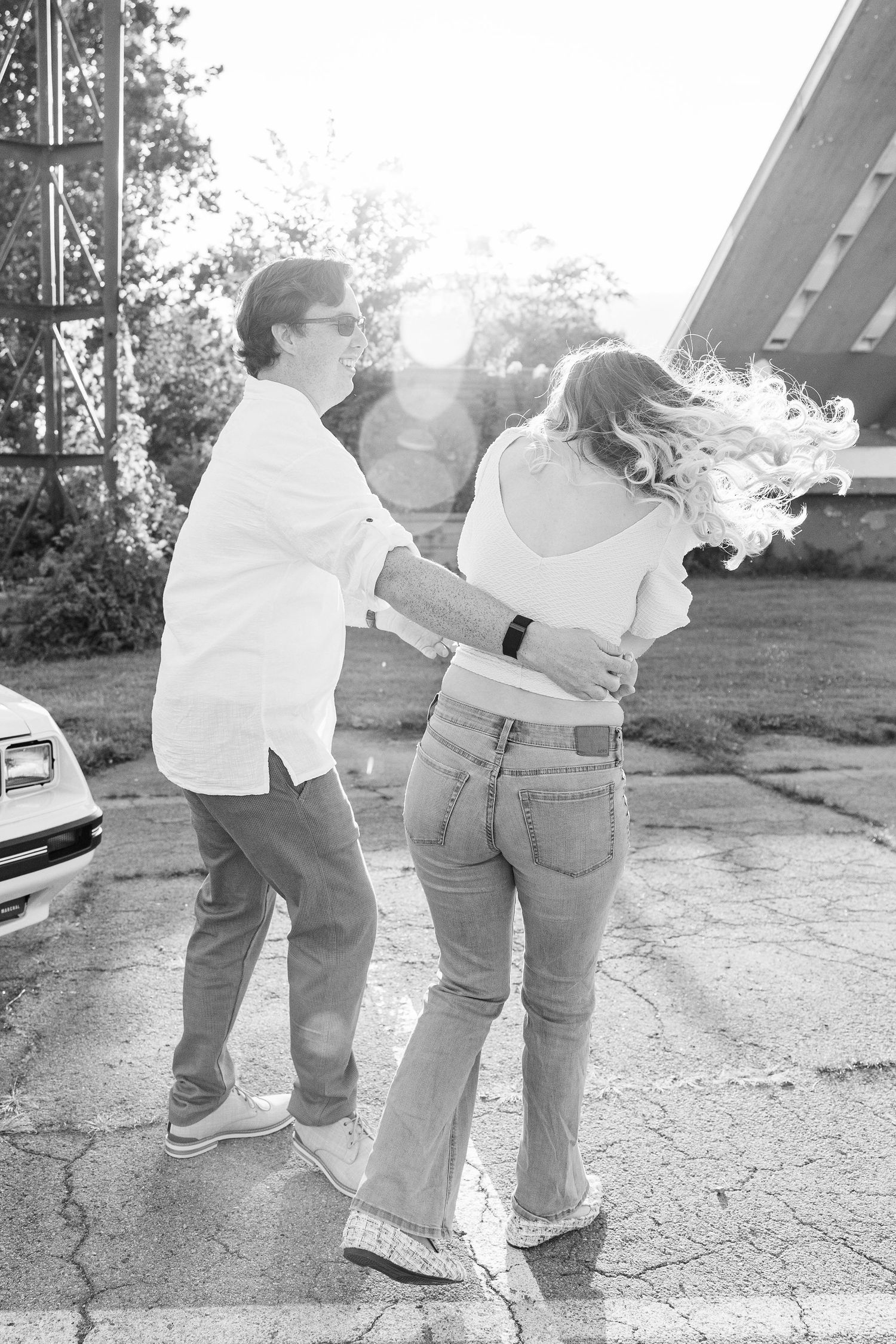 Engaged couple swing dancing at Belle Isle summer engagement session in Detroit, MI
