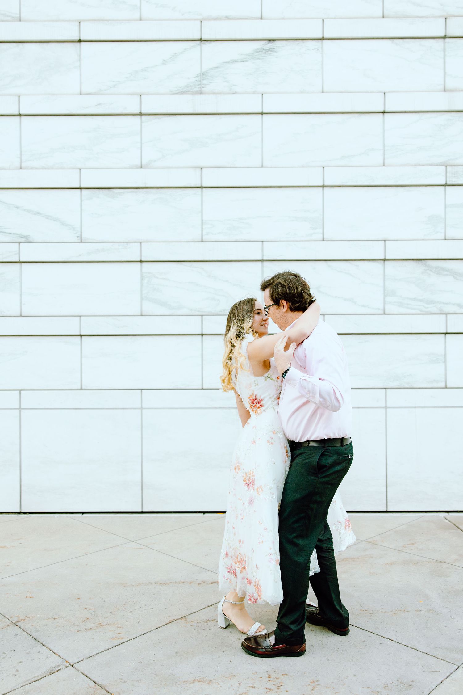 Engaged couple swing dancing at Detroit Institute of Arts engagement session in Detroit, MI