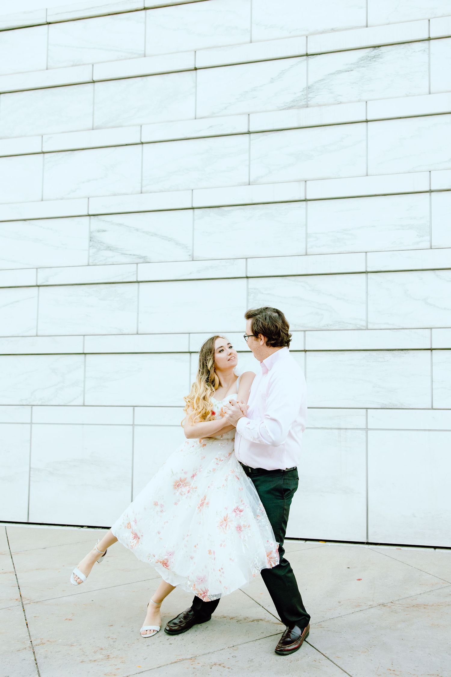 Engaged couple swing dancing at Detroit Institute of Arts engagement session in Detroit, MI